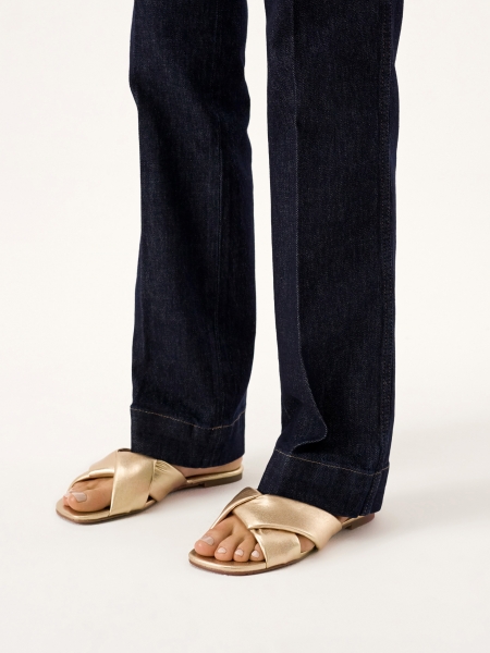 Flat slides made of golden leather ELANIE