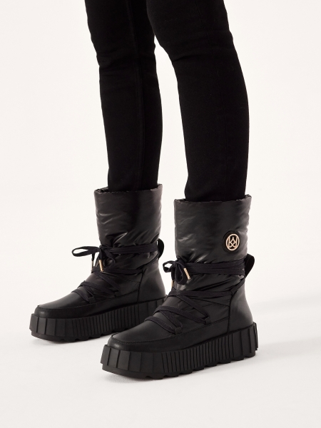 Insulated black snow boots with slip-on upper  DAGE