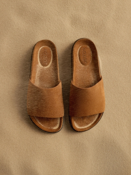 Brown suede slides on a cork sole  AUGRONNE