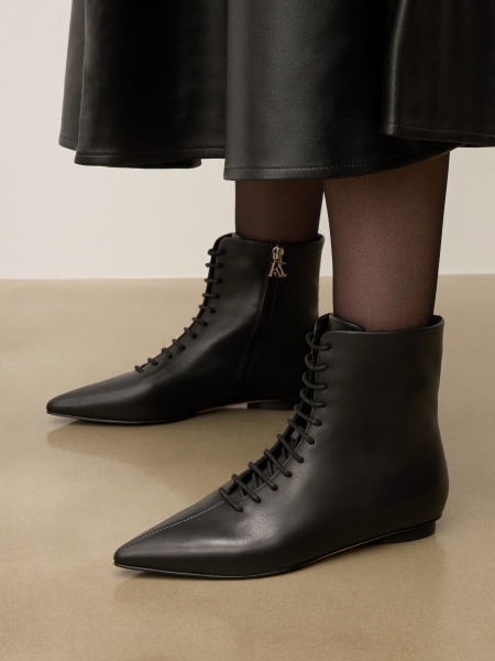 Black leather boots with zipper closure and silver logo-adorned toehold KS AMIENS