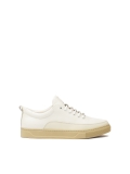White leather sneakers on a beige sole  AJAKS