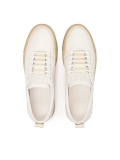 White leather sneakers on a beige sole  AJAKS