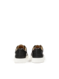 Black sneakers on a white sole AJAKS
