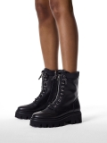 Black boots with a high upper on a trefoil sole  KS SALVA