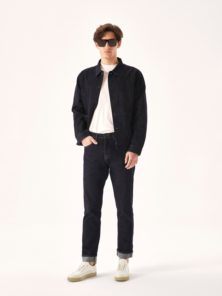 White leather sneakers on a beige sole  AJAKS