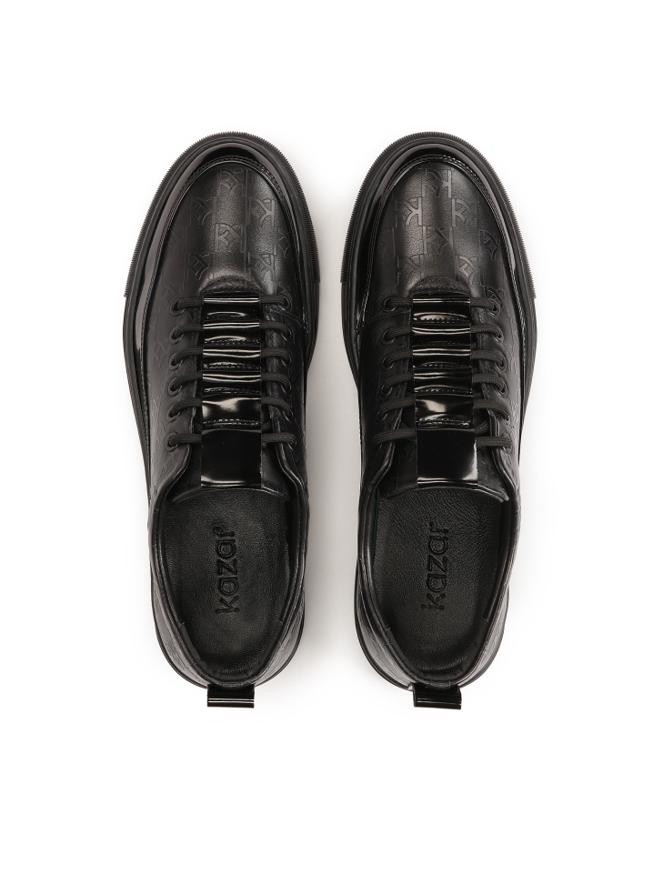 Black sneakers with embossed pattern AJAKS