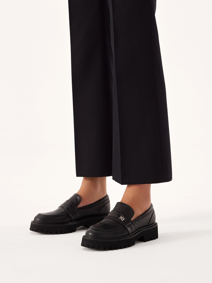 Black shoes on a treaded sole ESSEN