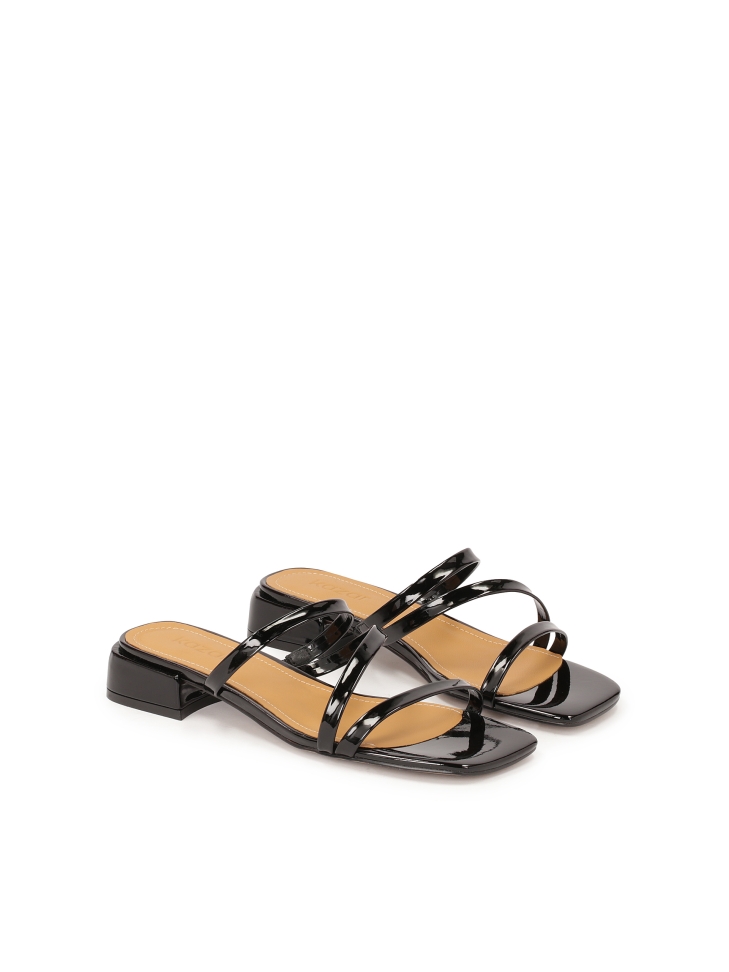 Mules on a flat sole made of patent leather TULIA