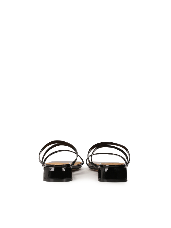 Mules on a flat sole made of patent leather TULIA