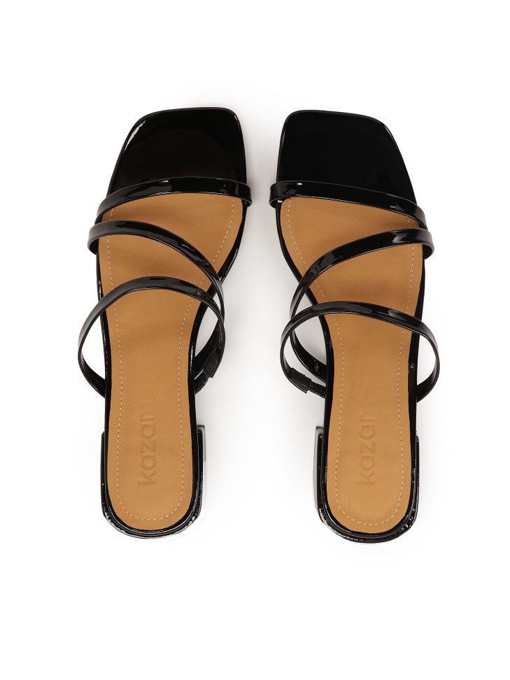 Mules on a flat sole made of patent leather TULIA