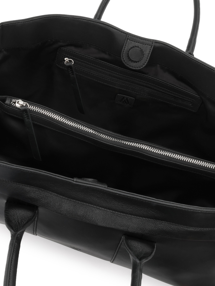 Black handbag made of soft natural leather with elongated cut KS VIORNE 